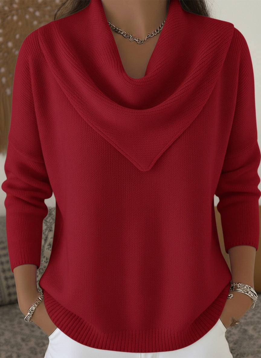 Red sweater worn by a person with a neutral background