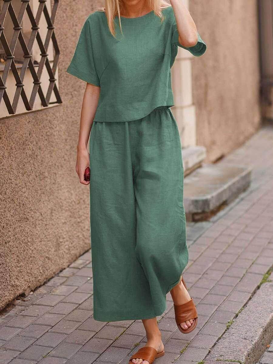 Woman in a green linen two-piece set and brown sandals walking outdoors, ZA-Zola fashion