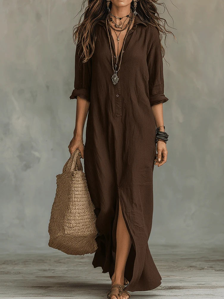 Woman wearing a brown dress holding a woven bag against a neutral background