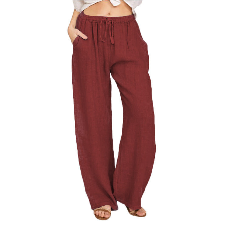 Maroon wide-leg pants worn by a person on a white background
