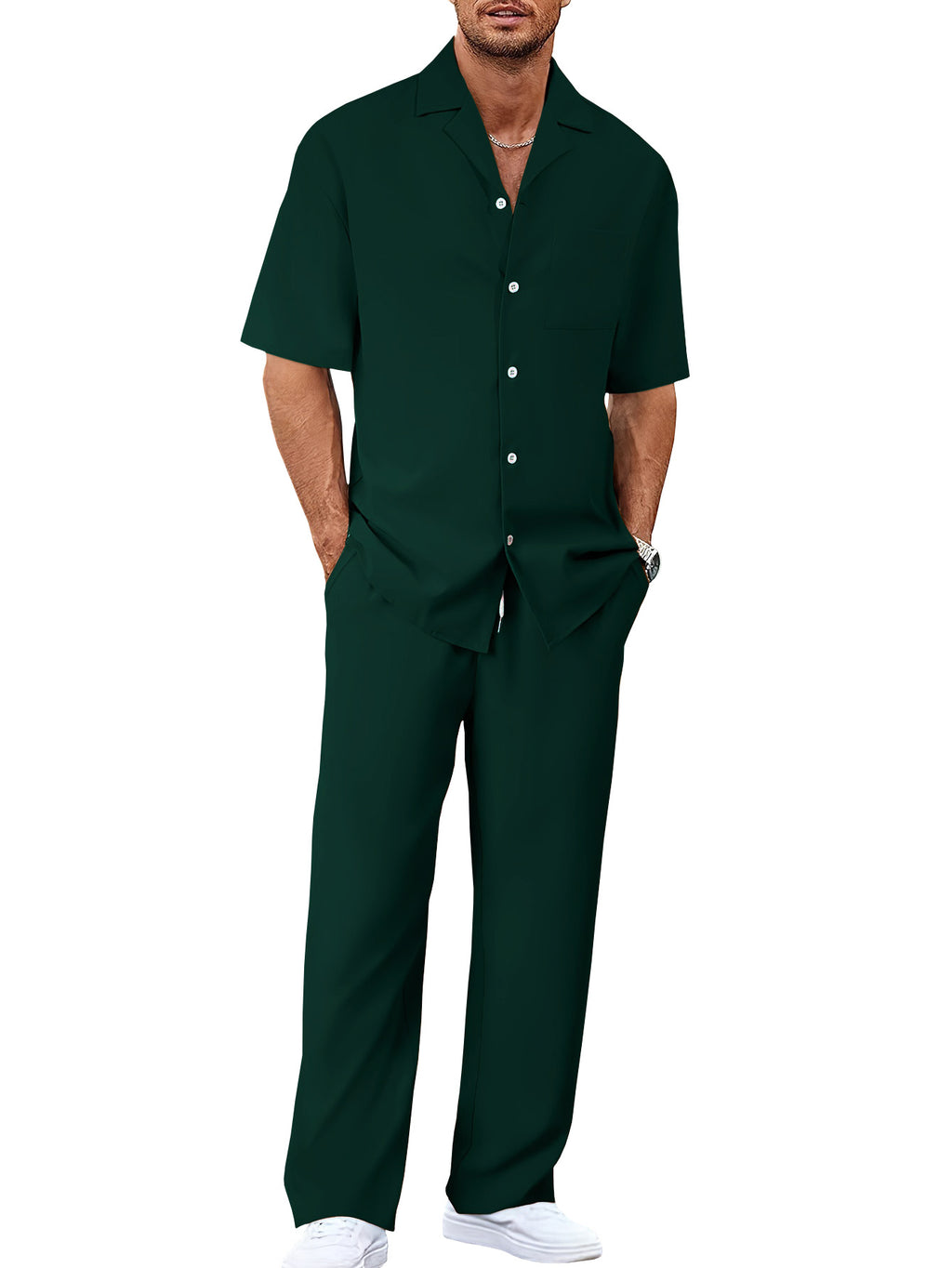 Man wearing an olive green shirt and pants on a white background