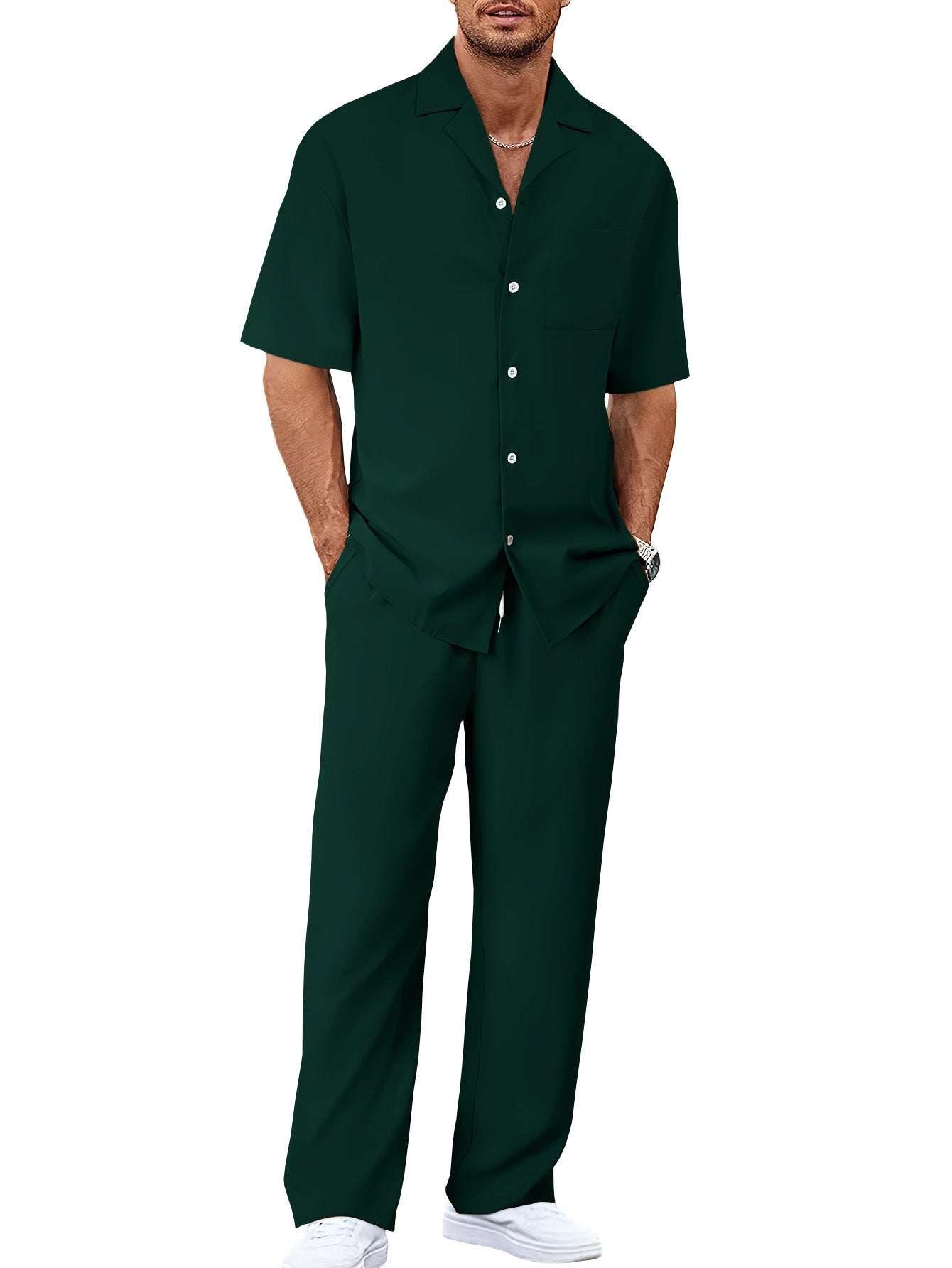 Man wearing an olive green shirt and pants on a white background
