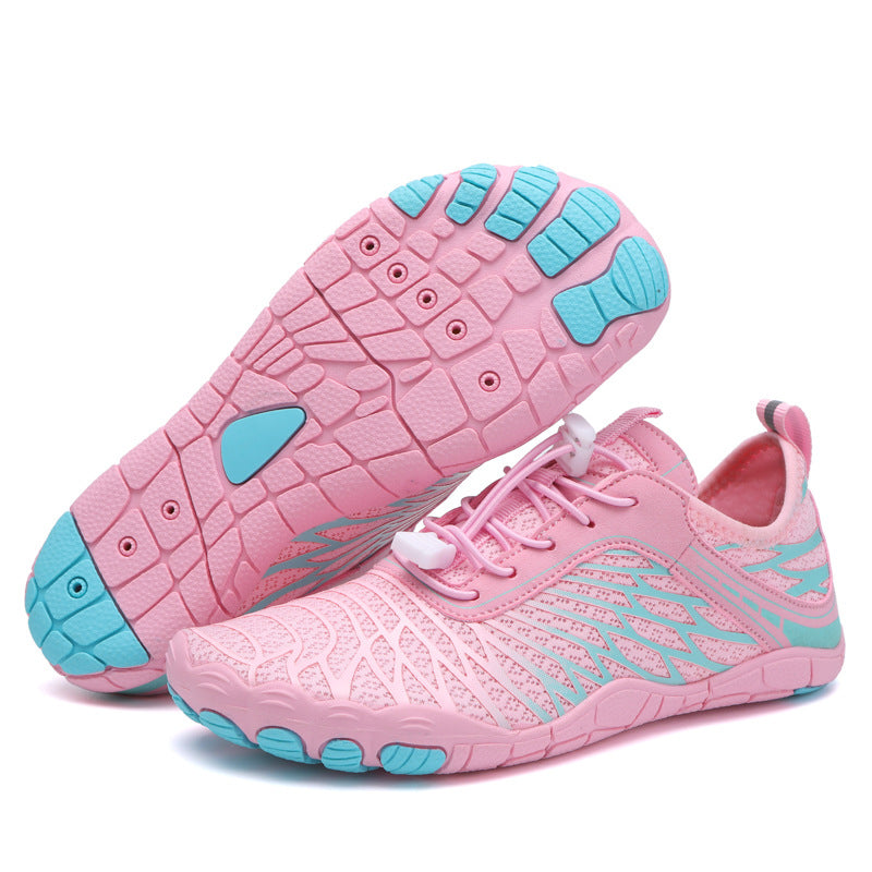 Pink and blue children's water shoes on a white background