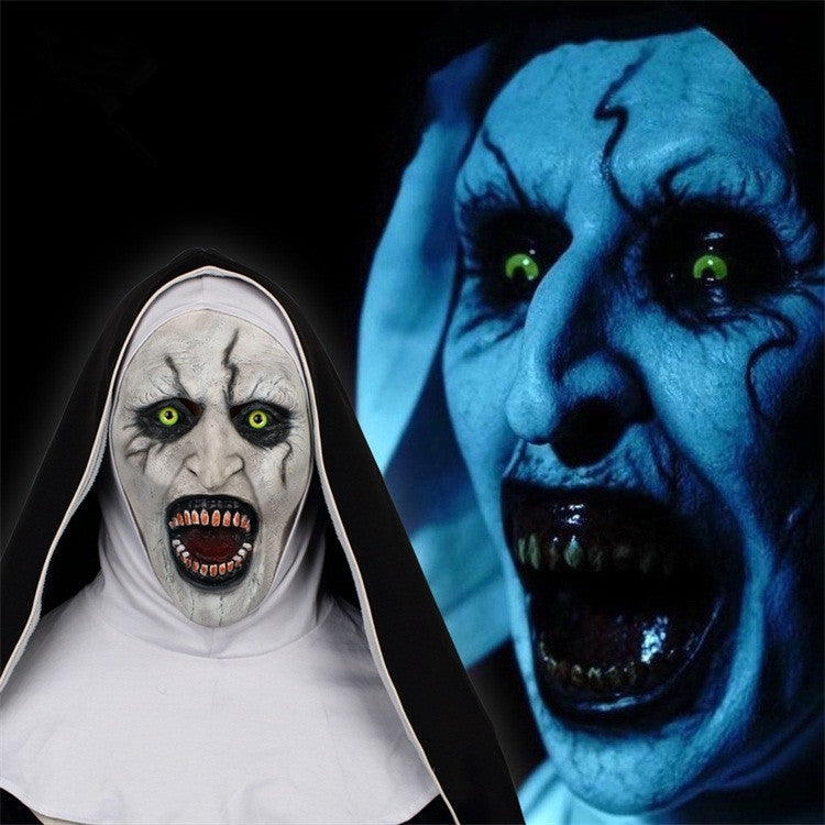 Two eerie masks, one resembling a nun and the other a blue-skinned creature with green eyes, on a black background.