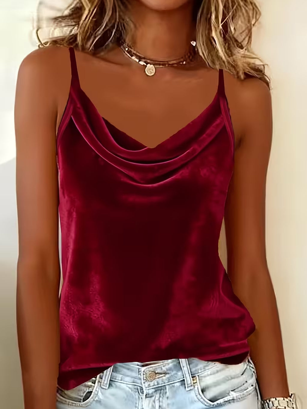 Red velvet tank top worn by a person with a neutral background