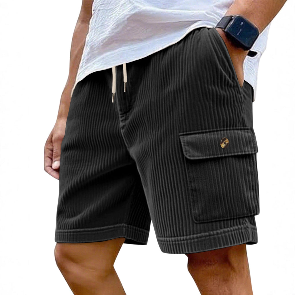 Person wearing dark gray cargo shorts on a white background