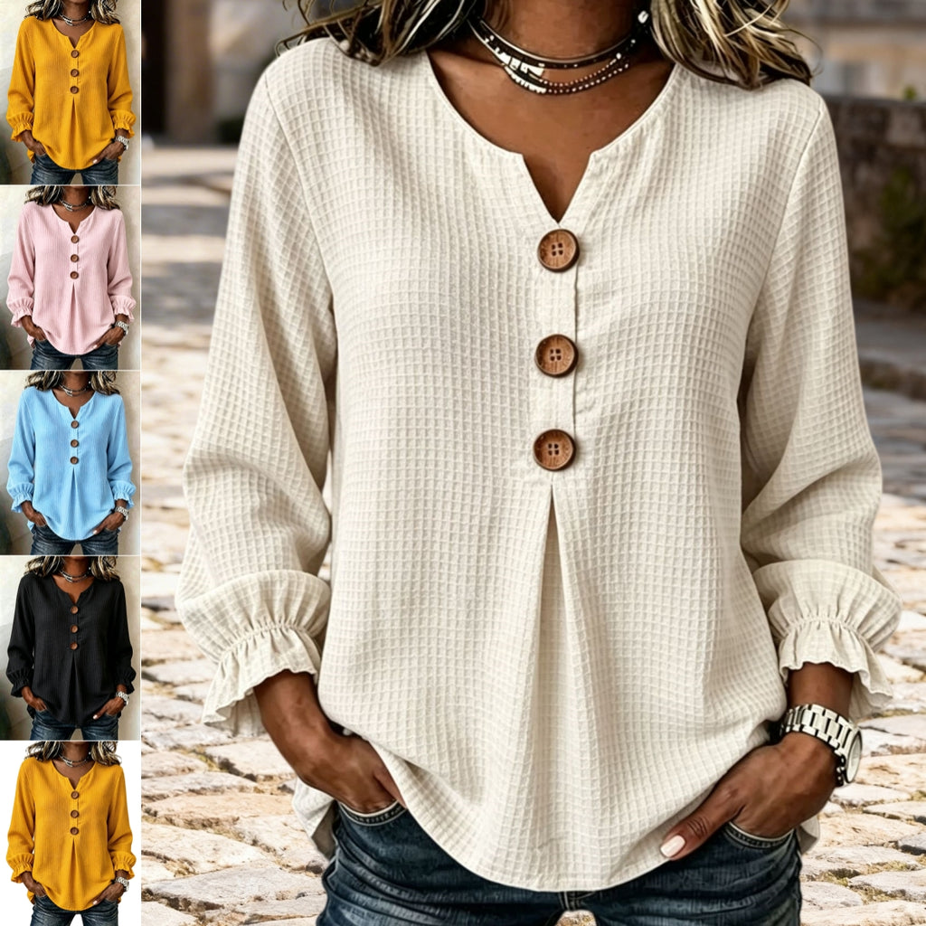 A woman wearing a cream-colored waffle-textured blouse with a split V-neck, three large brown buttons, and ruffled cuffs. The main image shows her from the shoulders down, while the left side features a vertical strip of six smaller color options showing the blouse in yellow, pink, light blue, black, and mustard.
