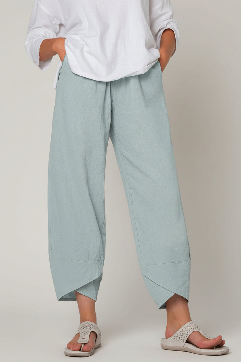 Light blue pants worn by a person on a white background