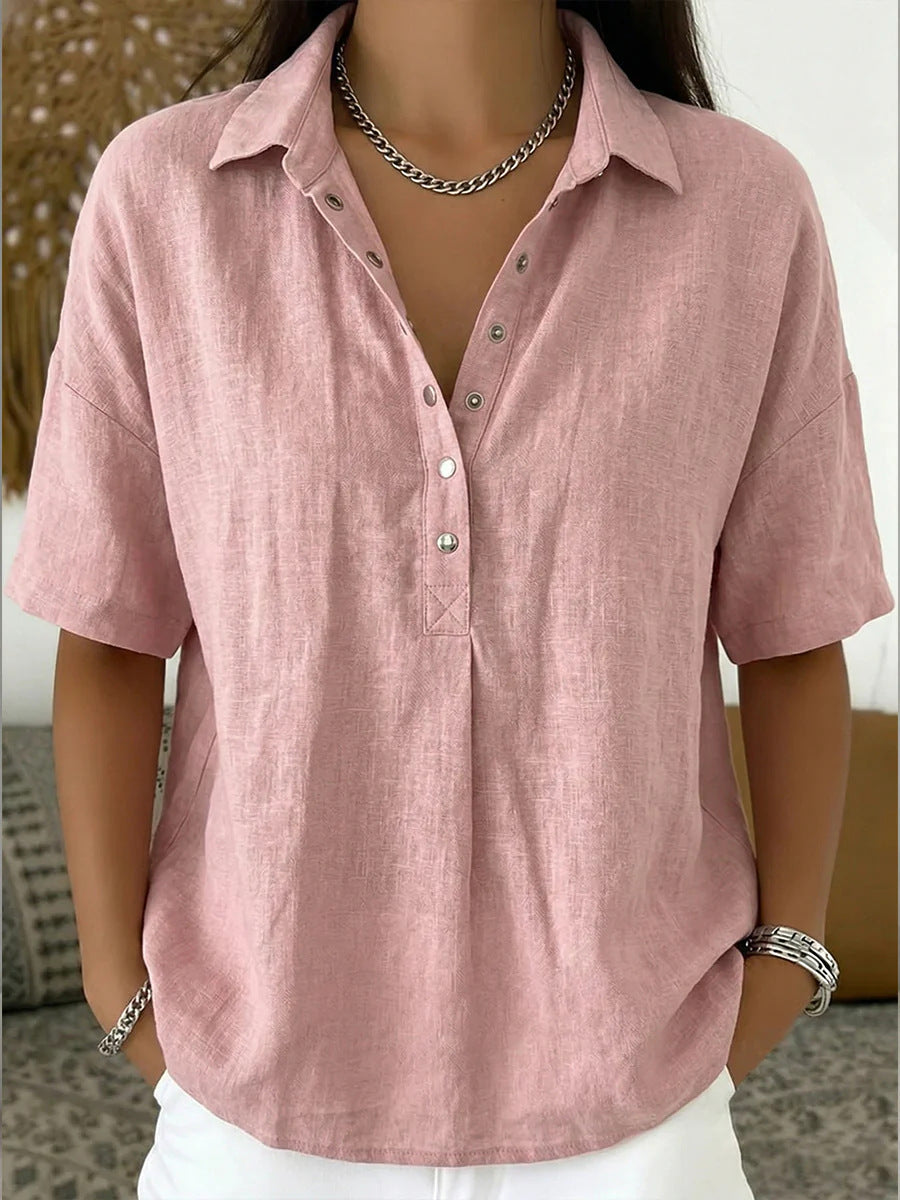 Pink linen shirt worn by a person with a neutral background