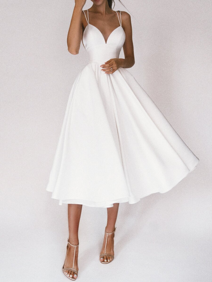 White dress with thin straps on a white background