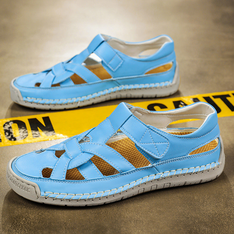 Pair of blue sandals with white soles on a brown surface with caution tape.