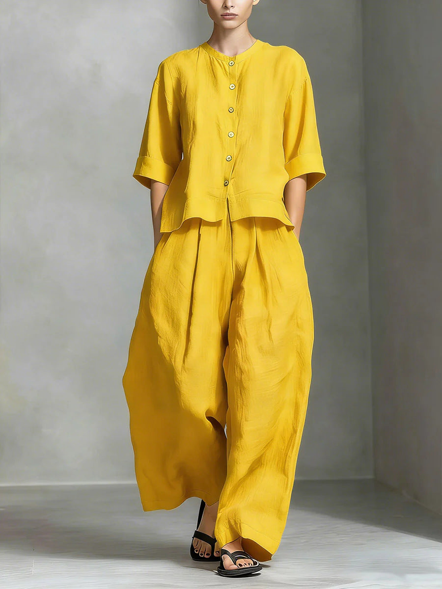 Person wearing a yellow outfit against a gray background
