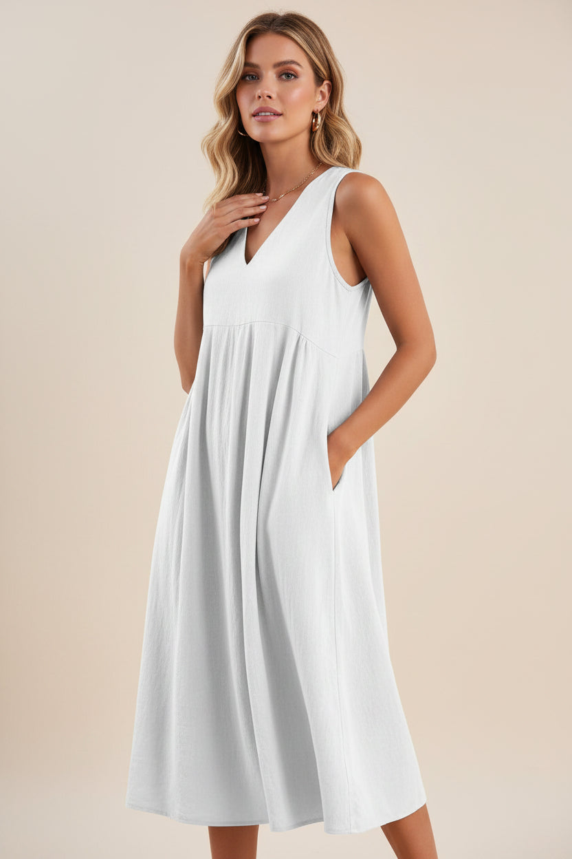 White sleeveless dress worn by a model on a white background