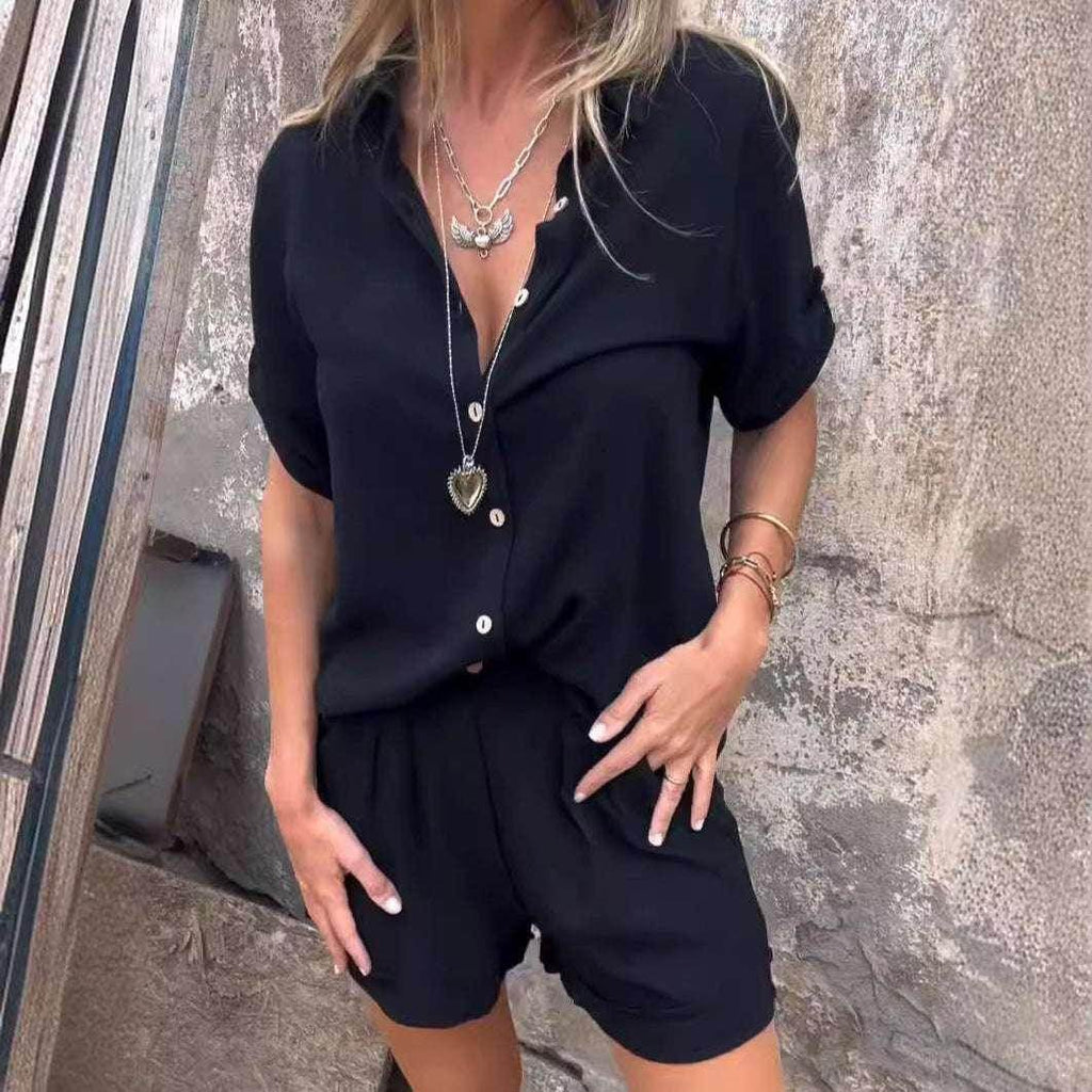 Woman wearing a trendy black button-up short sleeve shirt and shorts set from ZA-Zola
