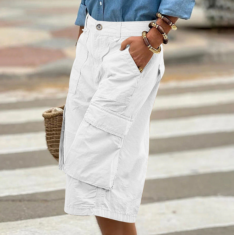 Person wearing a white cargo skirt with a blurred background