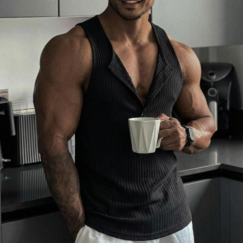 Muscular man holding a white mug in a kitchen setting