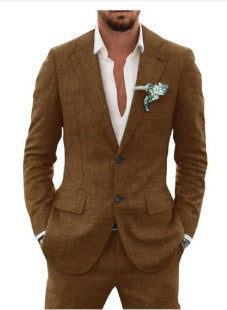 Man wearing a brown suit with a white shirt and floral boutonniere.