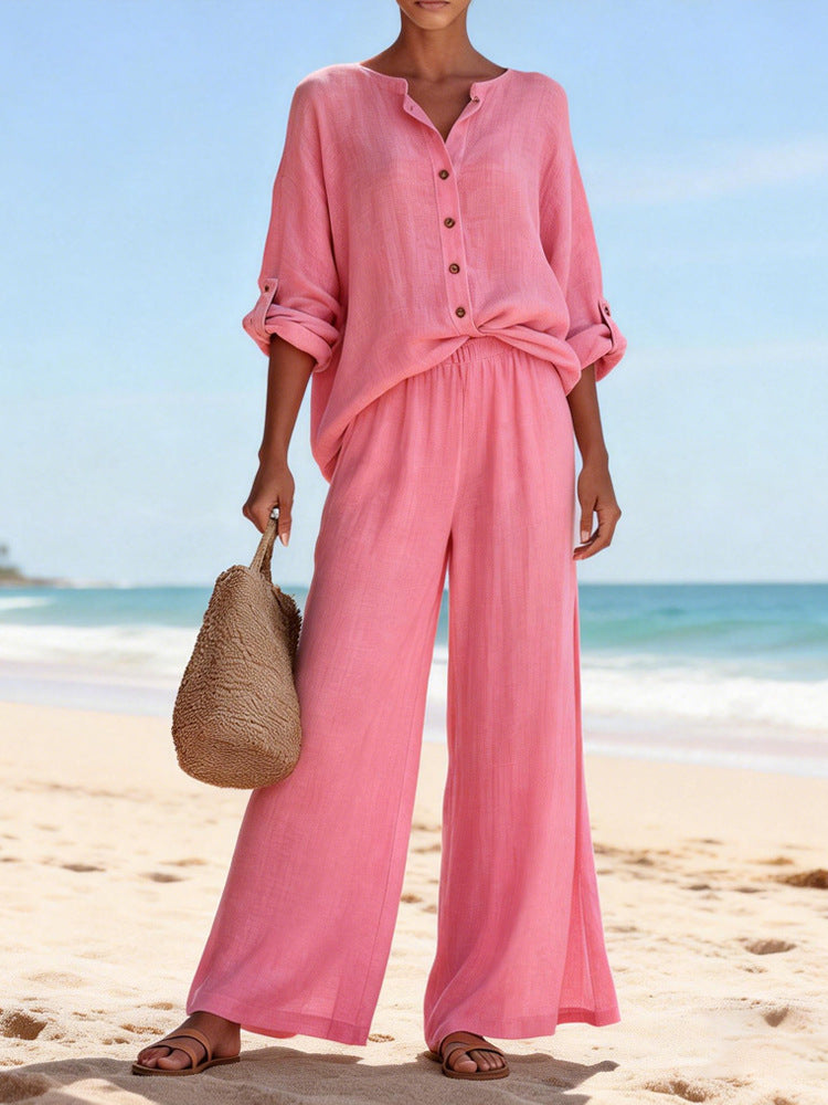 Person wearing a pink outfit on a beach