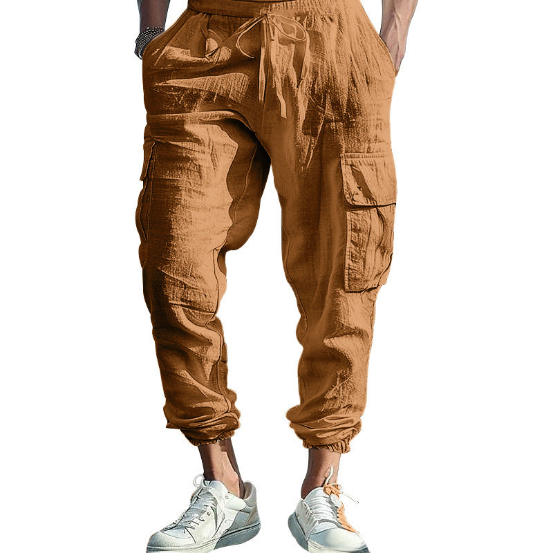Brown cargo jogger pants worn by a person on a white background