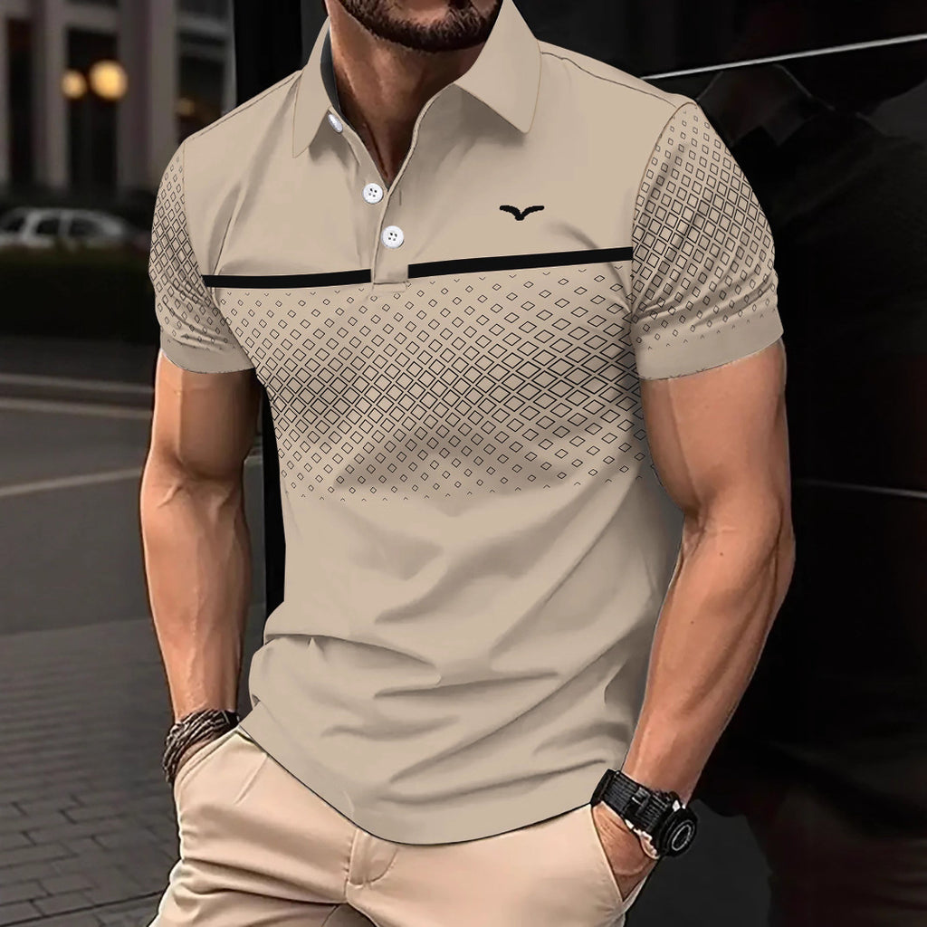 Man wearing a patterned beige polo shirt with a blurred background