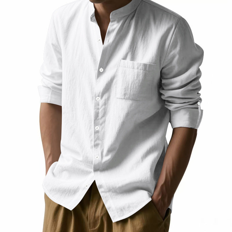 White long-sleeve shirt with rolled-up sleeves worn by a person on a white background