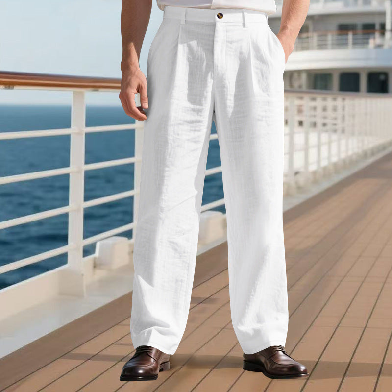 Person wearing white pants and brown shoes on a cruise ship deck with ocean view