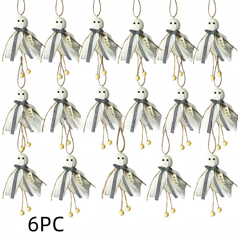 A set of 9 decorative hanging ornaments shaped like small ghosts, each with a white round head, black embroidered eyes and mouth, a sheer off-white cape, a black-and-white gingham ribbon bow, and dangling beige loops with small beige beads. The text '9PC' appears at the bottom left on a plain white background.