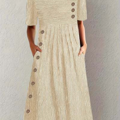 Beige dress with button details on a plain background