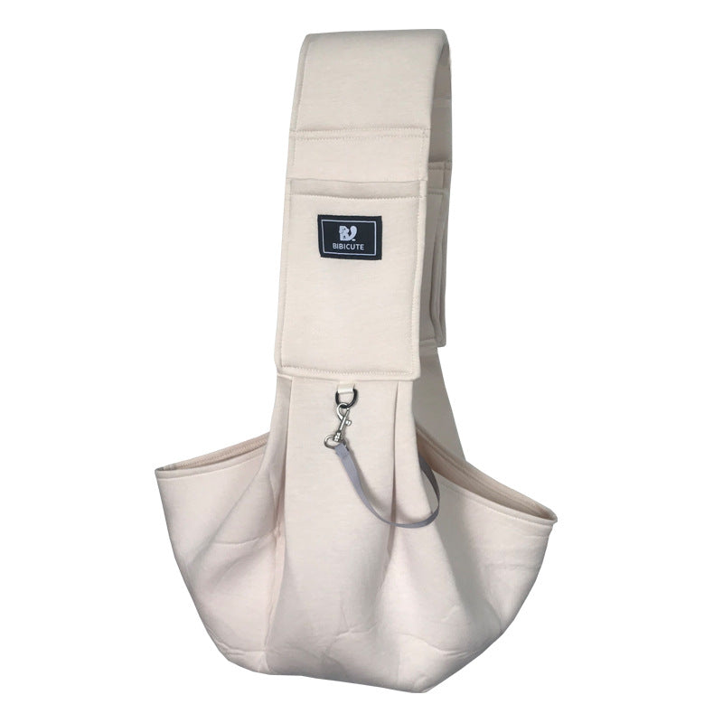 Beige baby carrier with a visible brand logo on a white background