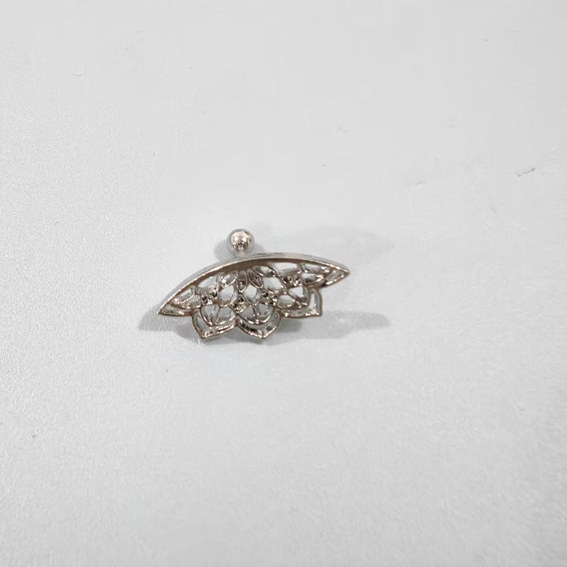 Silver brooch with floral design on a light gray background