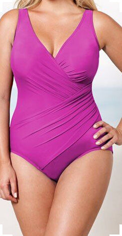 Purple swimsuit worn by a model on a light gray background