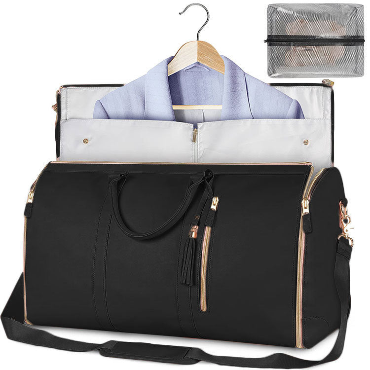Black travel bag with a garment on a hanger and a clear pouch inside, on a white background
