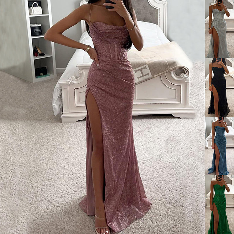 Woman in a sparkly pink evening gown with a high slit, standing in a bedroom.