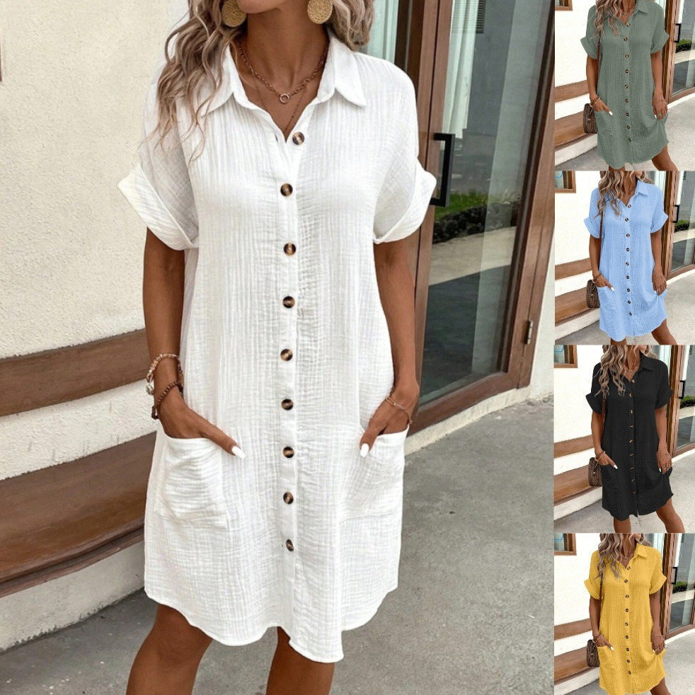 Woman wearing a white button-up dress with inset images of other dresses in different colors.