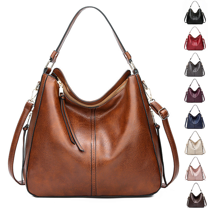 Brown leather handbag with multiple color options displayed on a white background