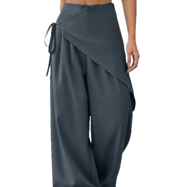 Dark gray wide-leg pants with a draped front design on a white background