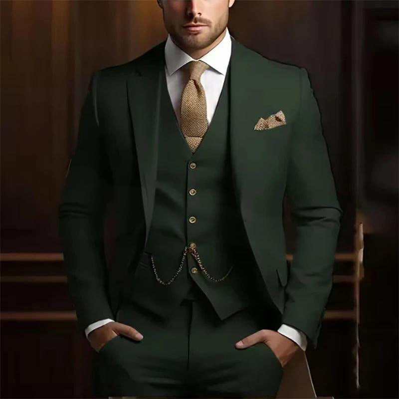 Man wearing a green suit with a patterned tie and pocket square against a dark background