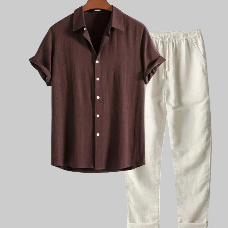 Brown shirt and white pants on a hanger with text indicating sizes.