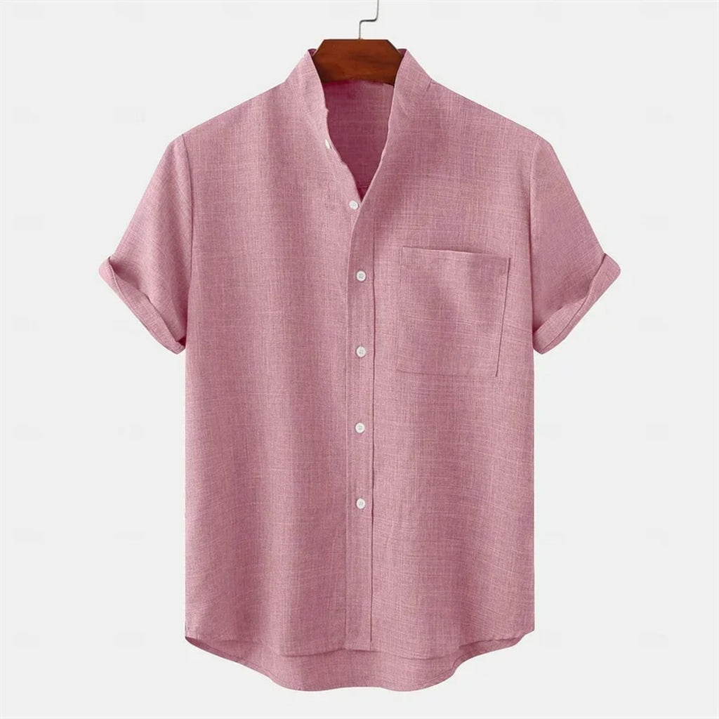 Pink short-sleeve shirt on a hanger with a white background