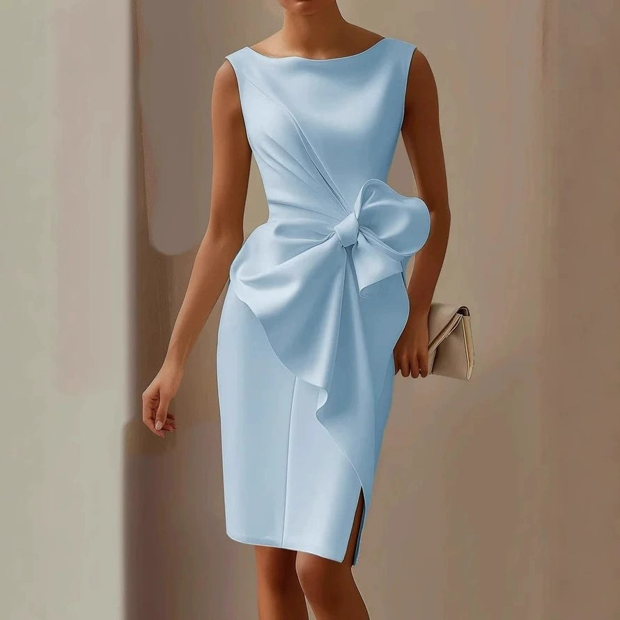 Light blue dress with a large bow detail on a plain background