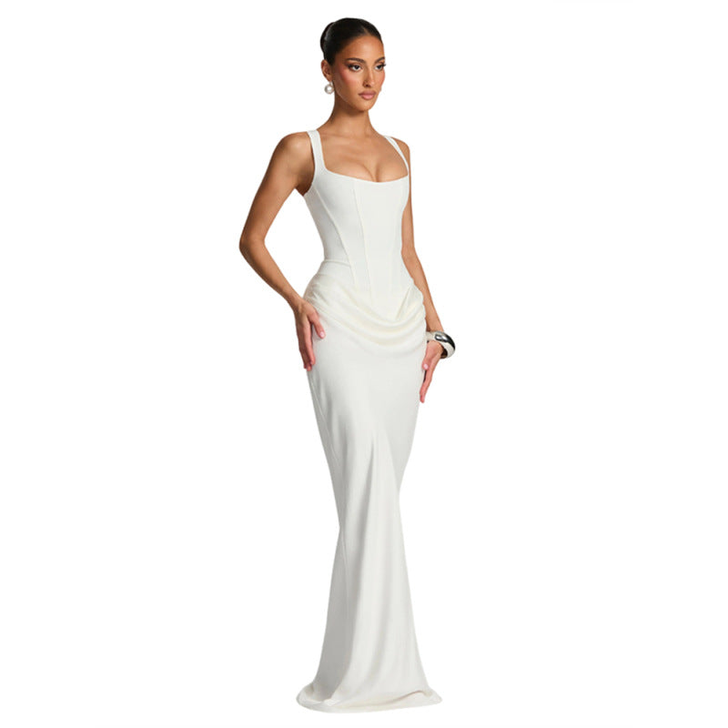 Woman wearing a white evening gown on a white background
