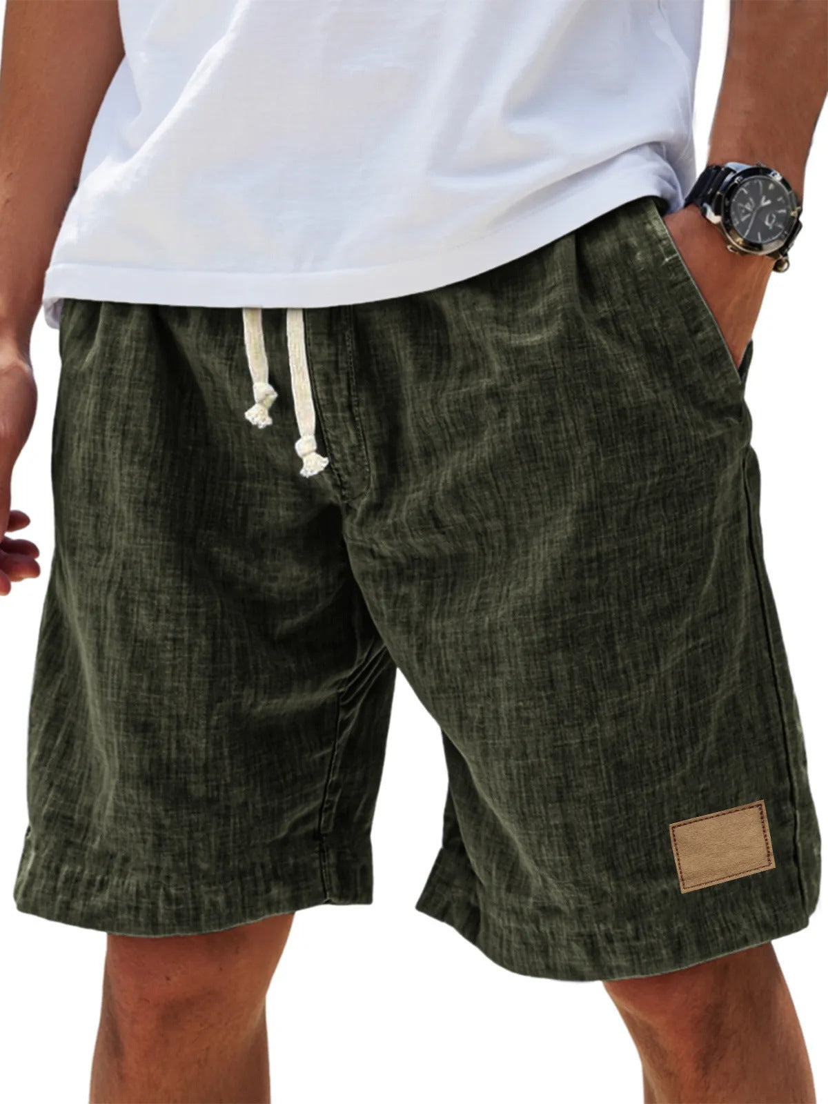 Green shorts with a brown patch on a white background