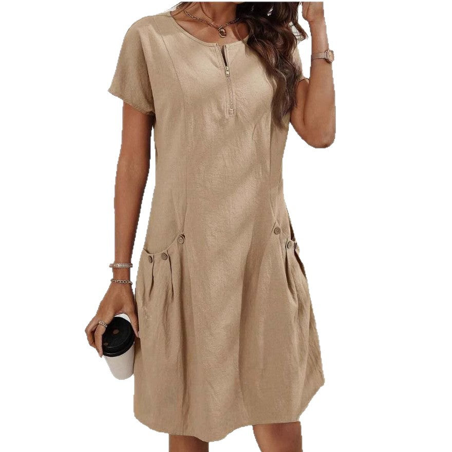 Beige dress worn by a person on a white background