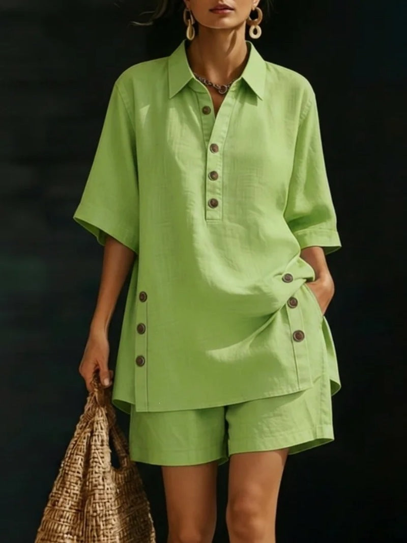 Woman wearing a green outfit with buttons against a dark background