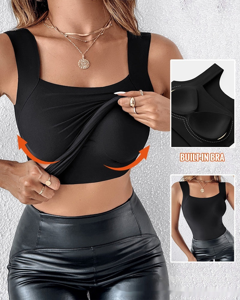 Black sports bra with built-in bra feature on a gray background