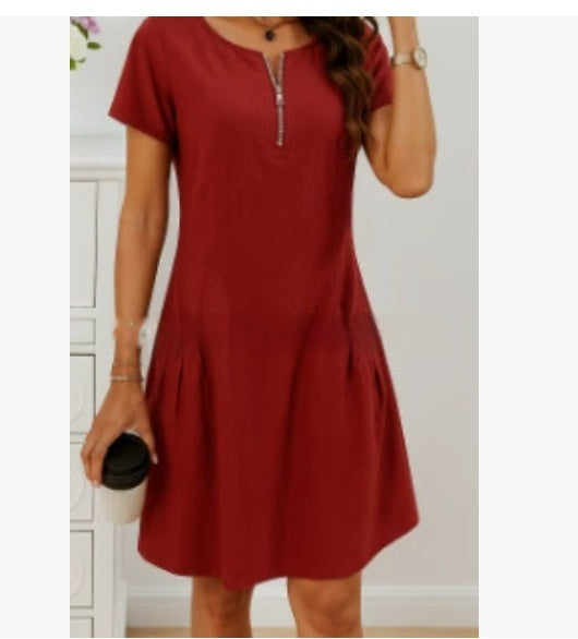 Red dress worn by a person against a neutral background