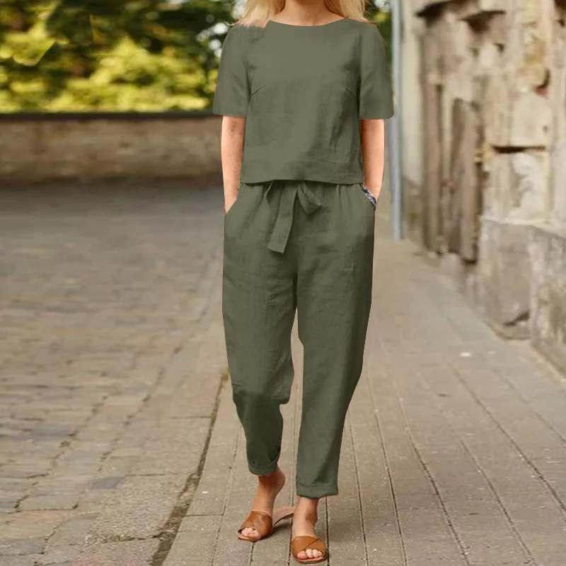 Woman wearing olive green two-piece outfit and sandals on a city street, ZA-Zola fashion