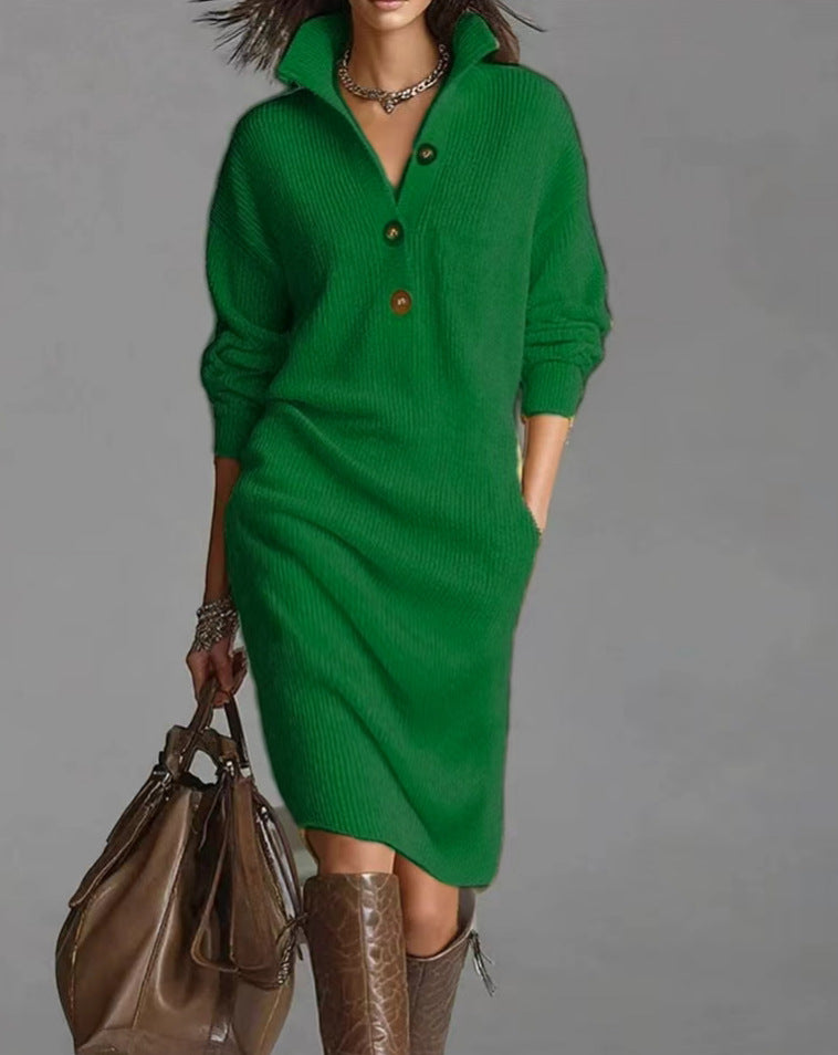 Green sweater dress worn by a person on a gray background