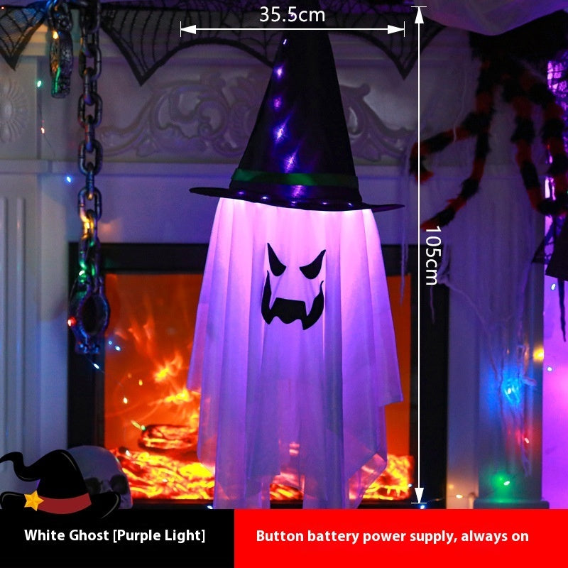 Halloween decoration with a ghost in a witch hat and purple light, shown with measurements and battery information.