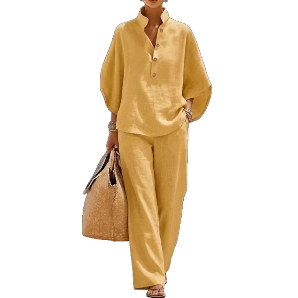 Woman wearing a mustard yellow outfit with a matching bag on a white background